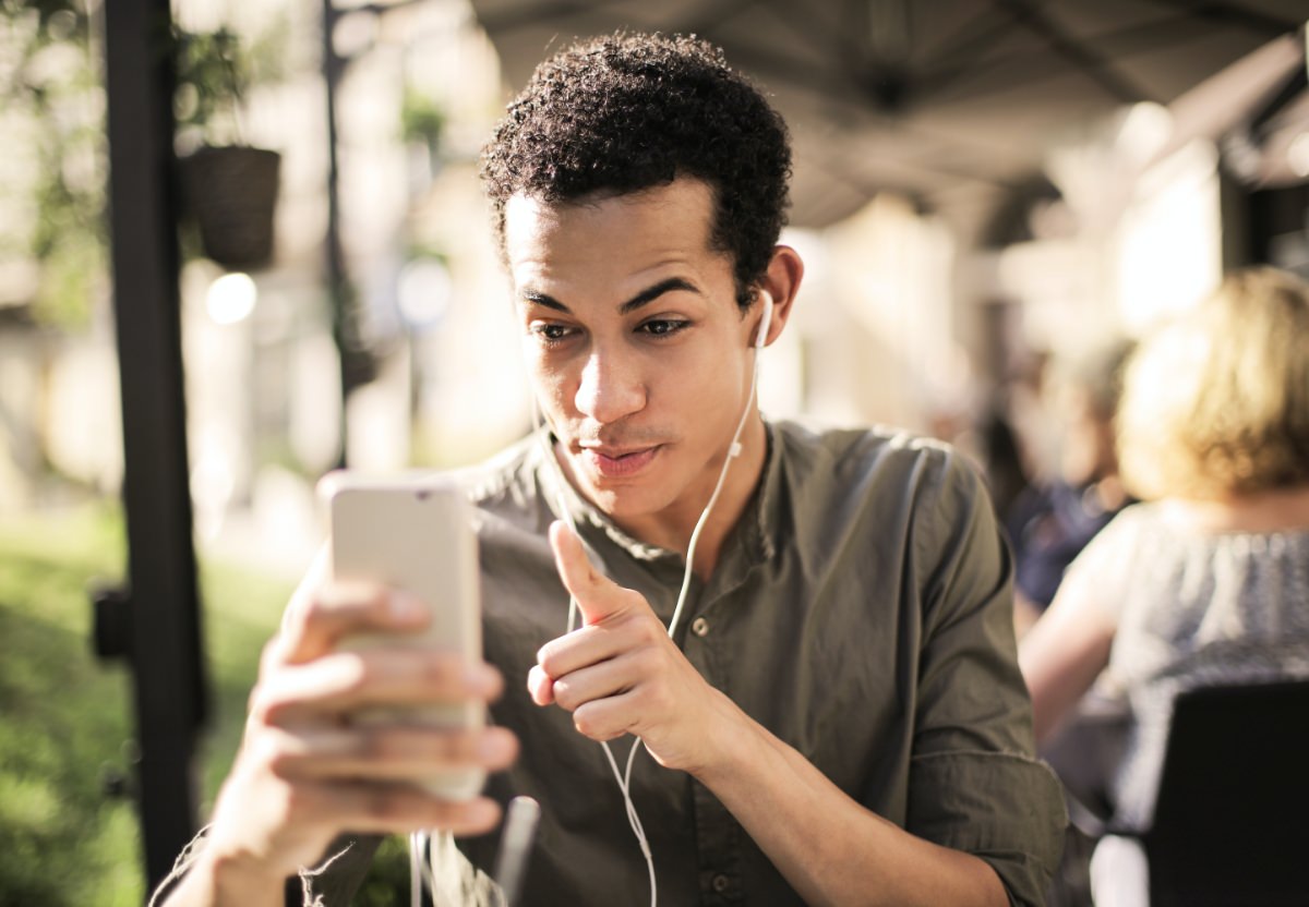 a man wearing earphones on a call