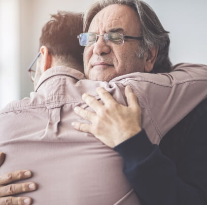 two men hugging
                     
